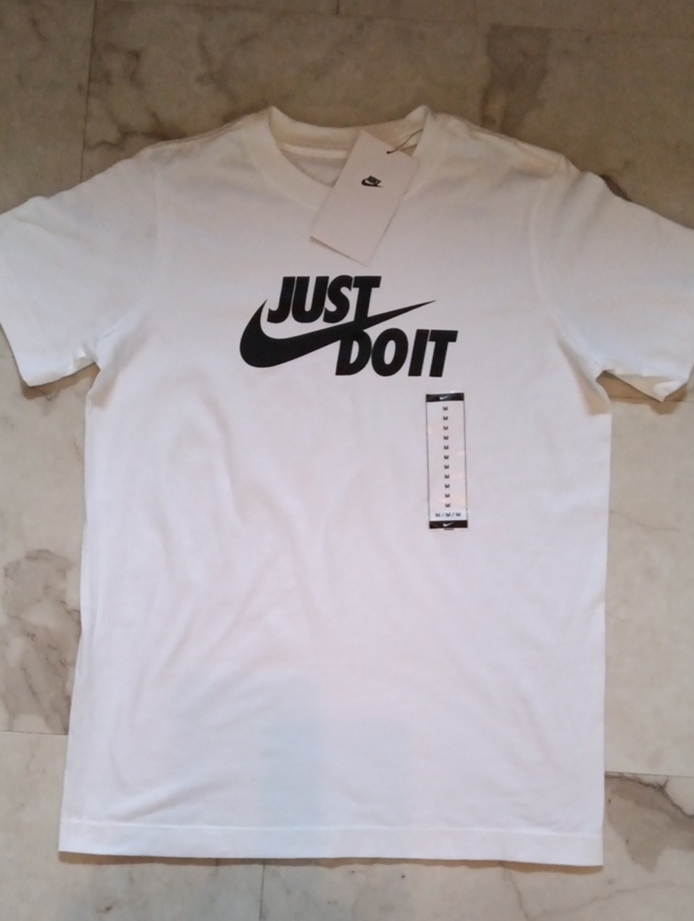 Nike White Short Sleeve Tee with Black 'Just Do It' Logo